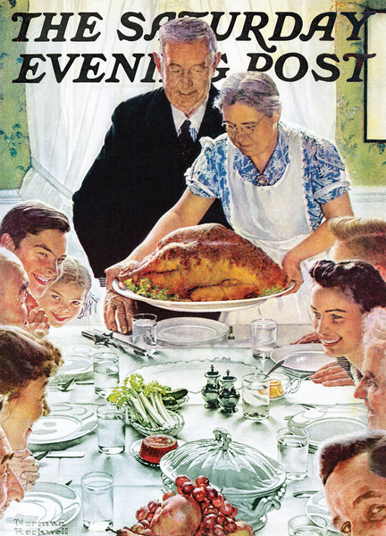 picture of a family gathered around the dinner table for thanksgiving dinner, while a grandma and grandpa stand at the end of the table.  The grandma is placing a turkey.
